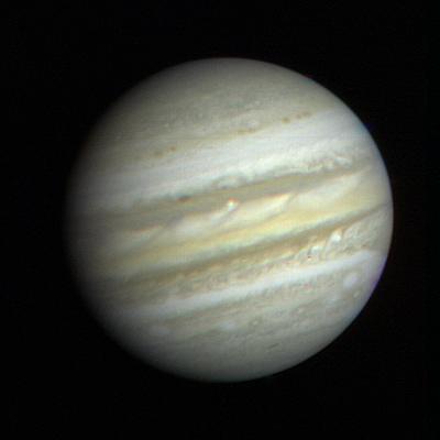 Voyager 1's first close-up image of Jupiter, taken January 6, 1979, with the Great Red Spot visible.