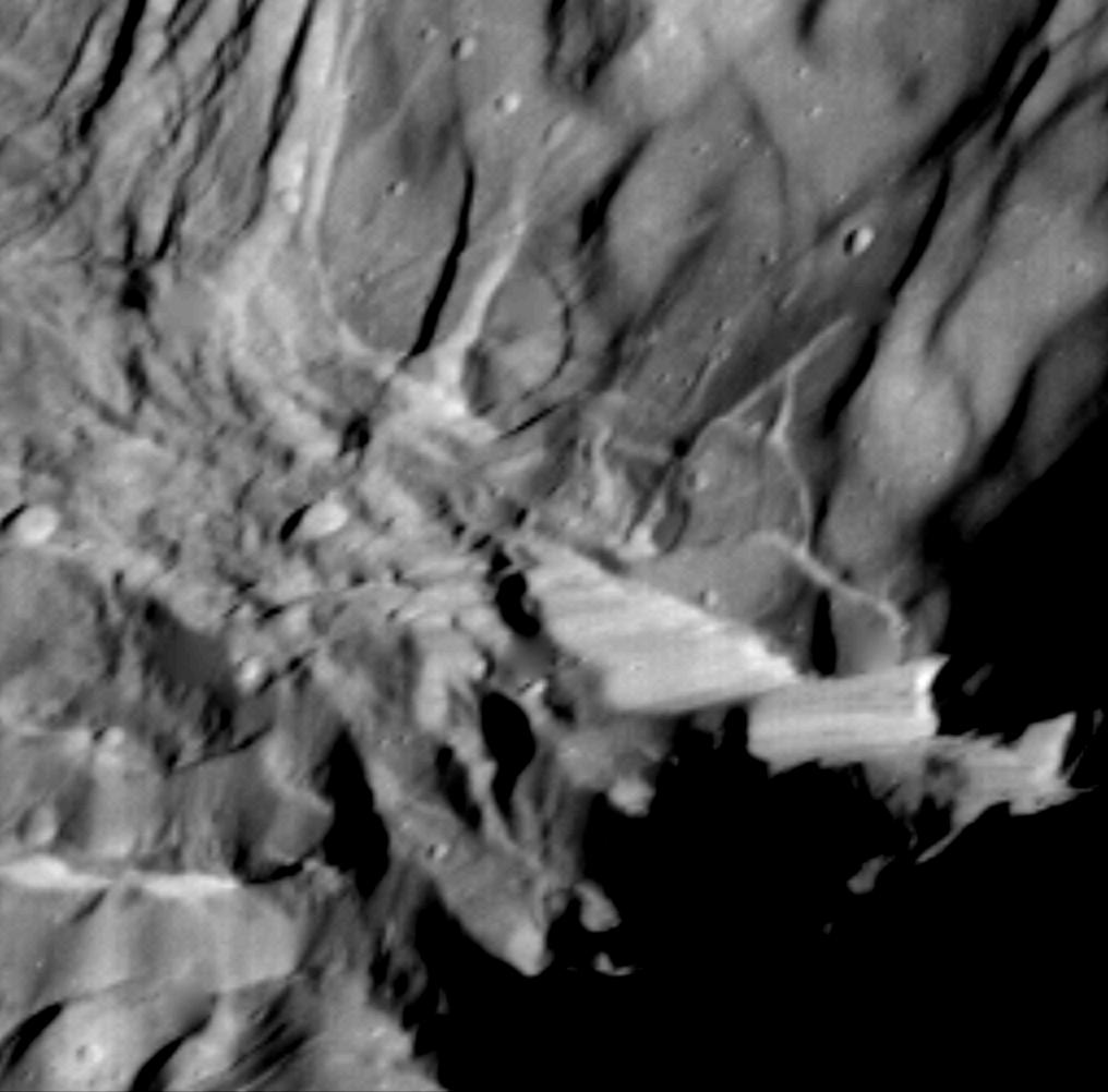 Miranda, moon of Uranus, photographed by Voyager 2 in 1986, showing extreme jumbled terrain and giant cliffs. NASA/JPL.