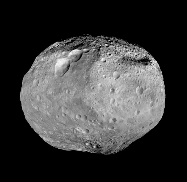 Full view of the giant asteroid Vesta, a mosaic from NASA's Dawn spacecraft showing a battered grey surface