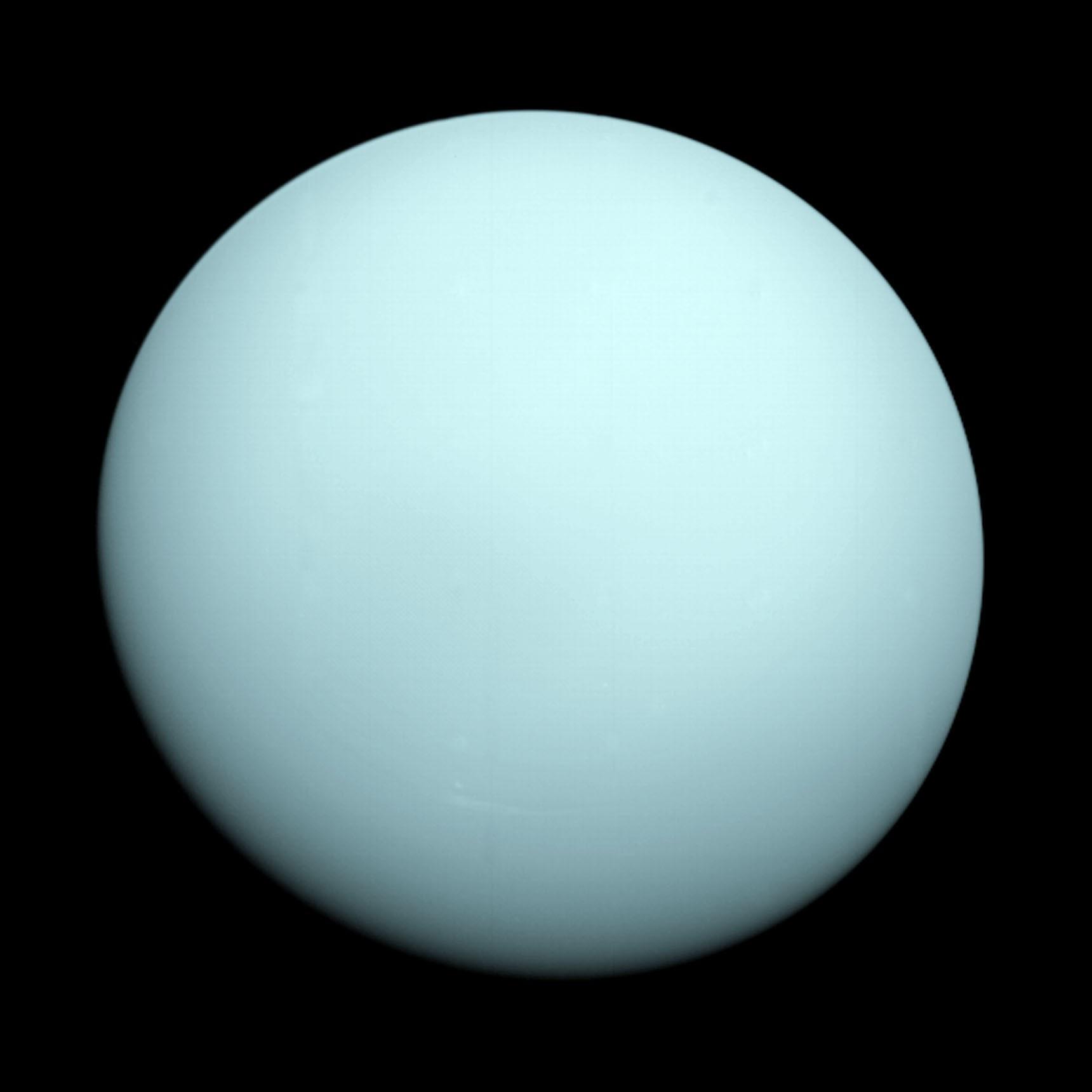 Uranus as seen by Voyager 2 on January 14, 1986 — a nearly featureless pale blue-green disk.