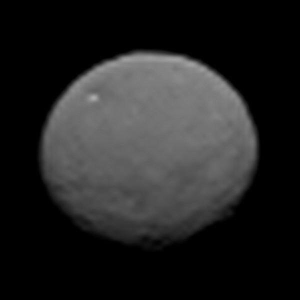 Grayscale image of Ceres from NASA's Dawn spacecraft during its January 2015 approach, with the bright spot of Occator Crater visible