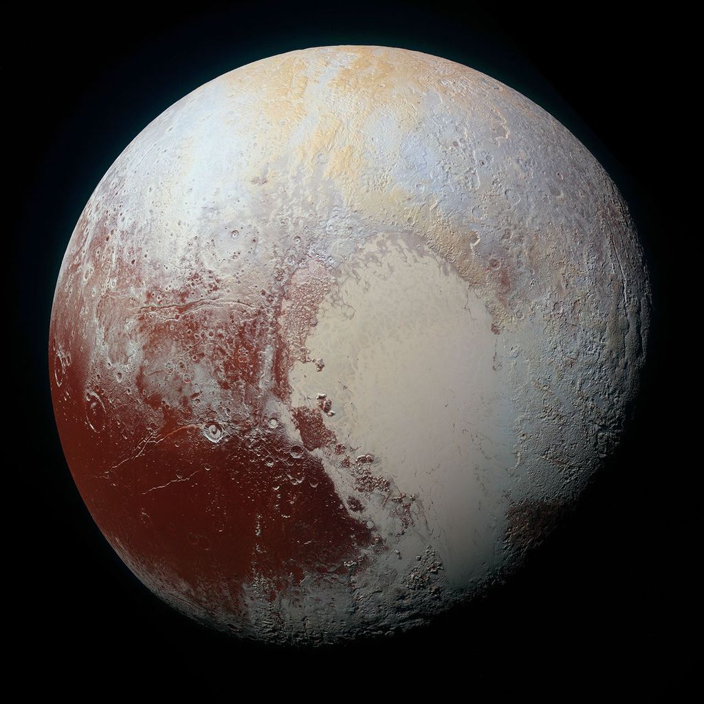 Pluto in true color from New Horizons, showing the large pale heart-shaped nitrogen-ice plain Tombaugh Regio