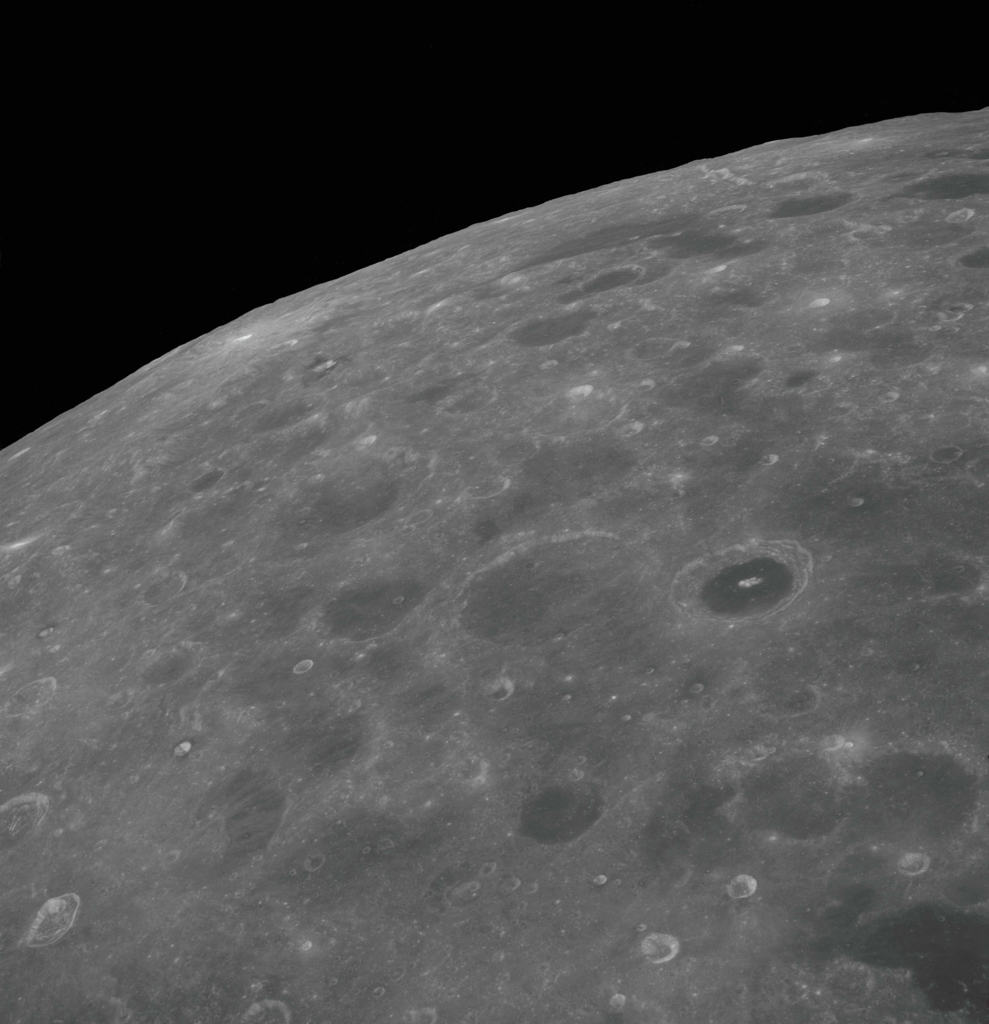 Apollo 8 lunar far side photograph showing heavily cratered terrain never seen by humans before.