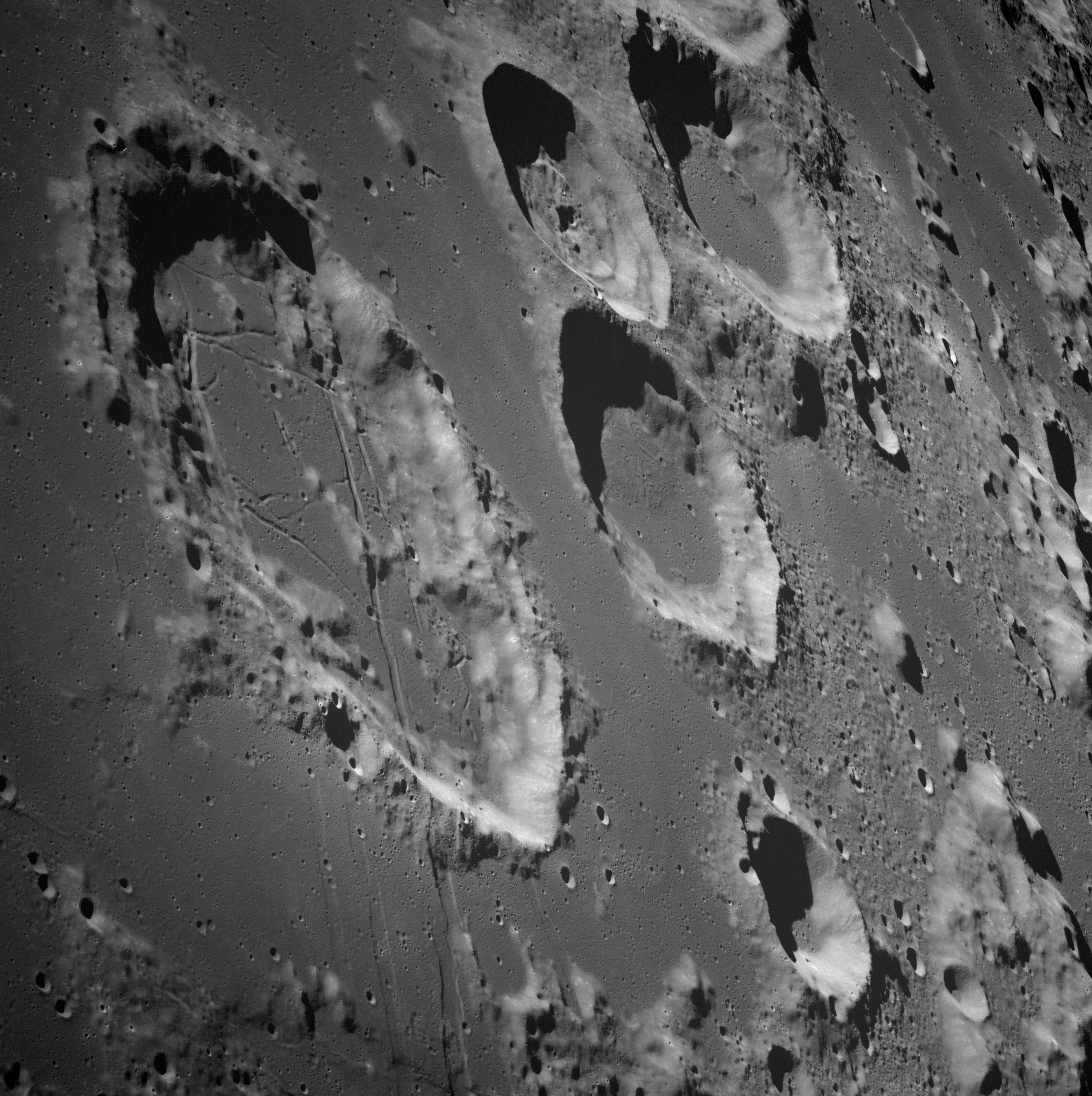 Apollo 8 telephoto image of crater Tsiolkovsky on the lunar far side with dark mare floor.