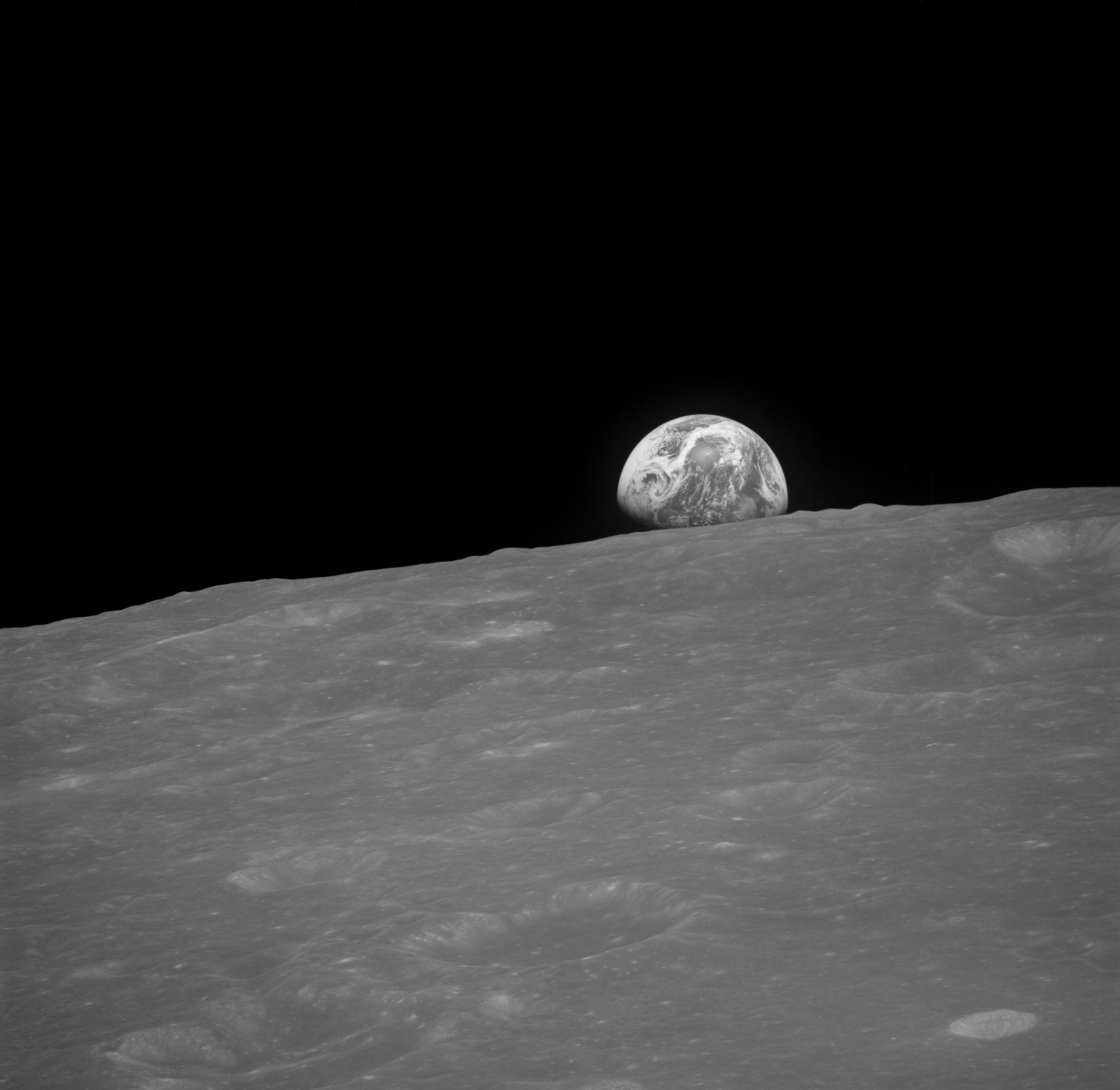 Black and white Earthrise photograph AS8-13-2329 taken minutes before the famous color frame by Bill Anders.
