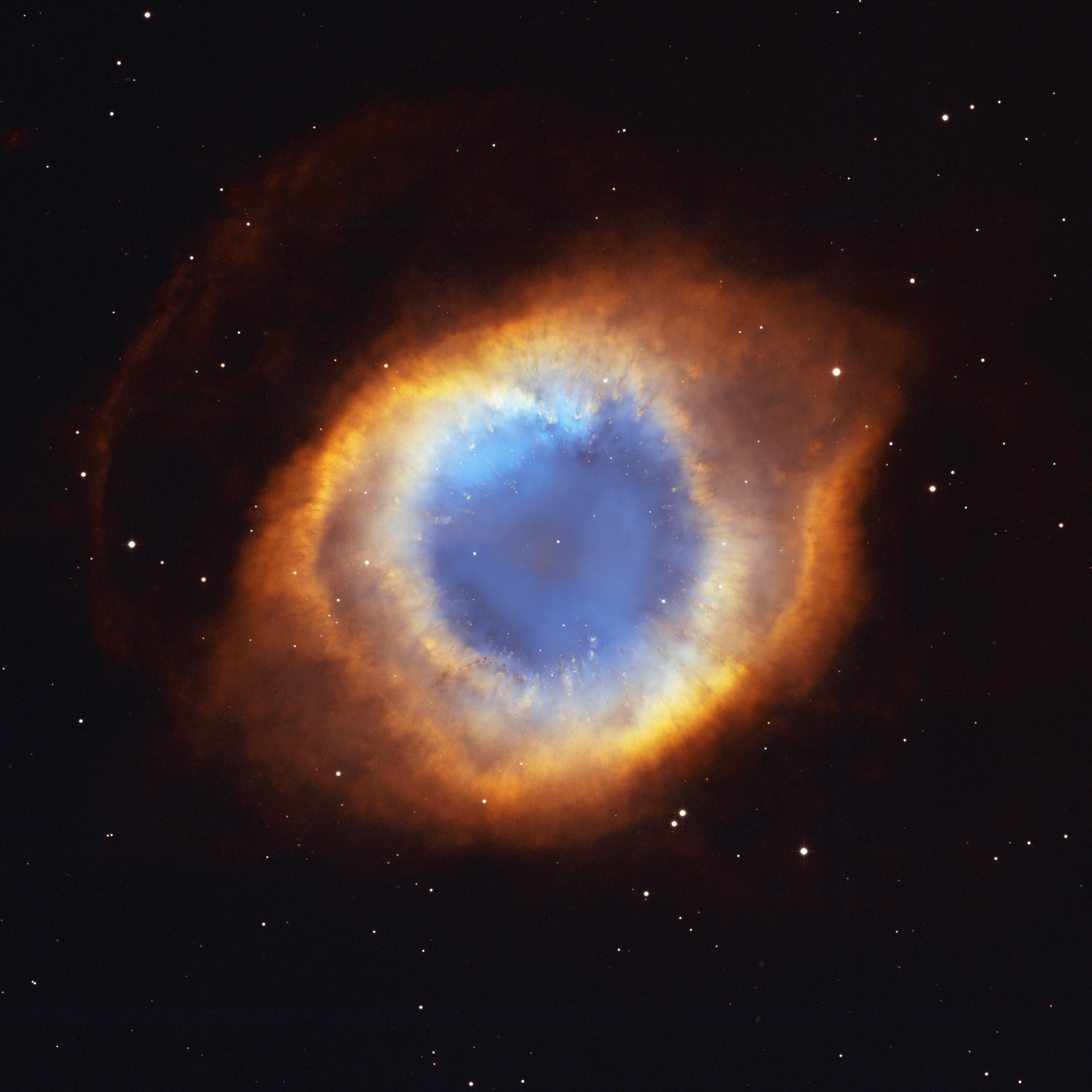The Helix Nebula, a huge glowing eye of gas cast off by a dying Sun-like star