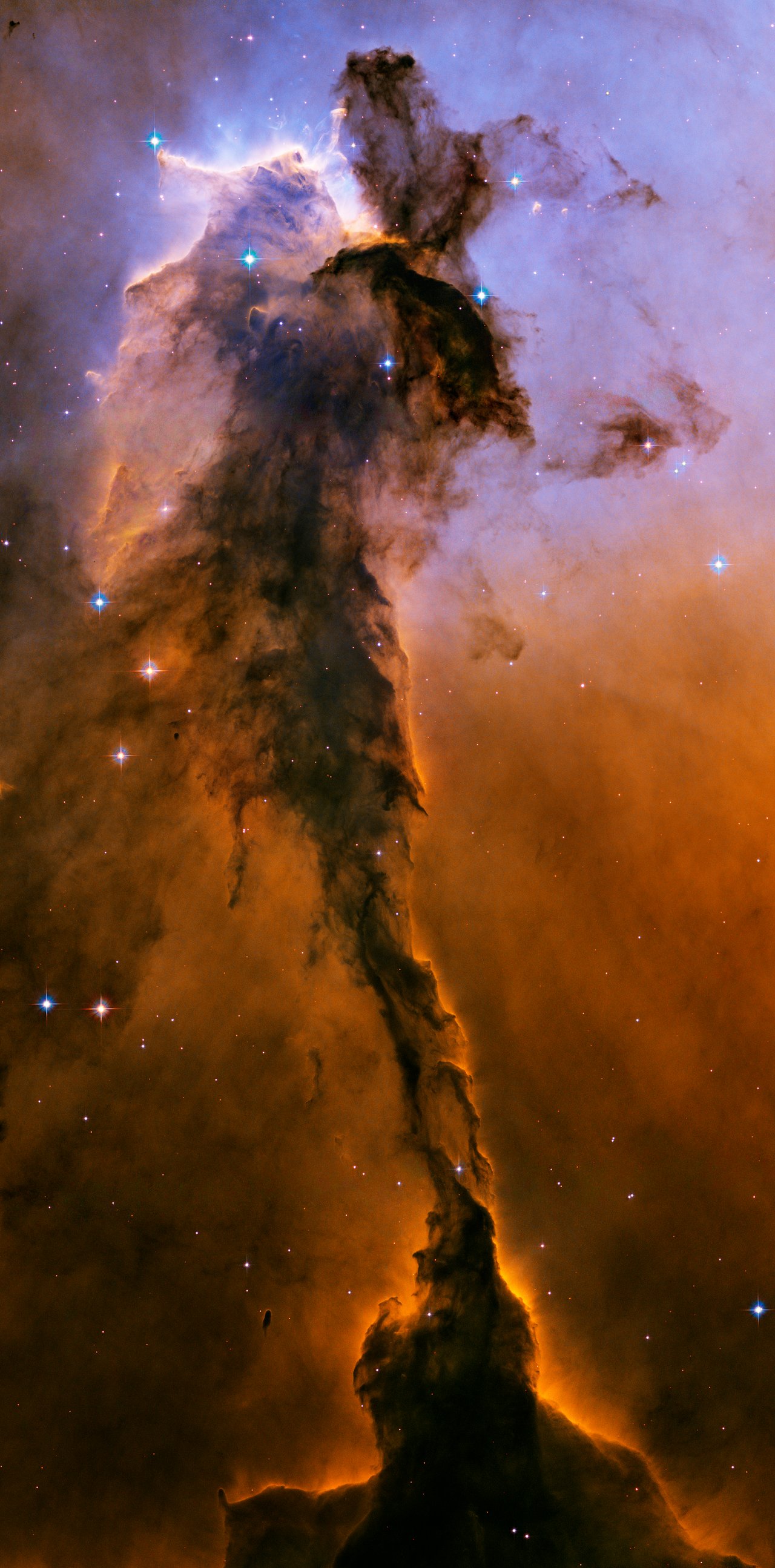 Hubble two-panel comparison of M51 — a visible-light view beside an infrared view that cuts through the dust to reveal the underlying structure and the bridge of material connecting M51 to its companion NGC 5195.