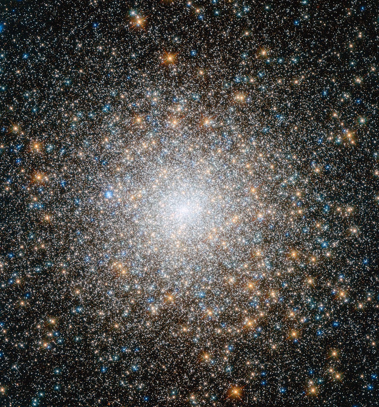 The globular cluster Messier 15 in Pegasus — Hubble image of a dense ball of hundreds of thousands of stars with a brilliant core.