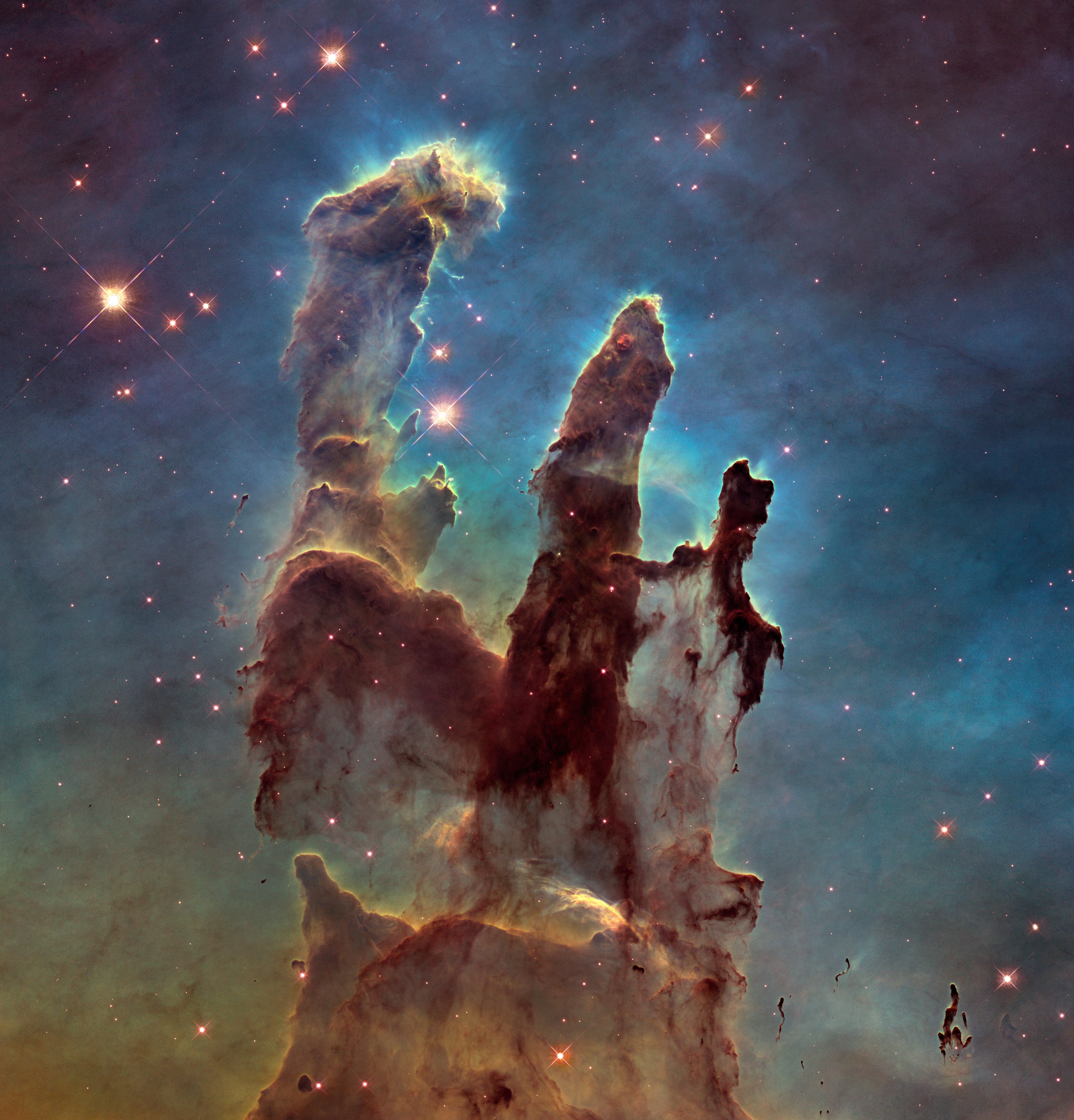 The Pillars of Creation in visible light from the Hubble Space Telescope, opaque and moody