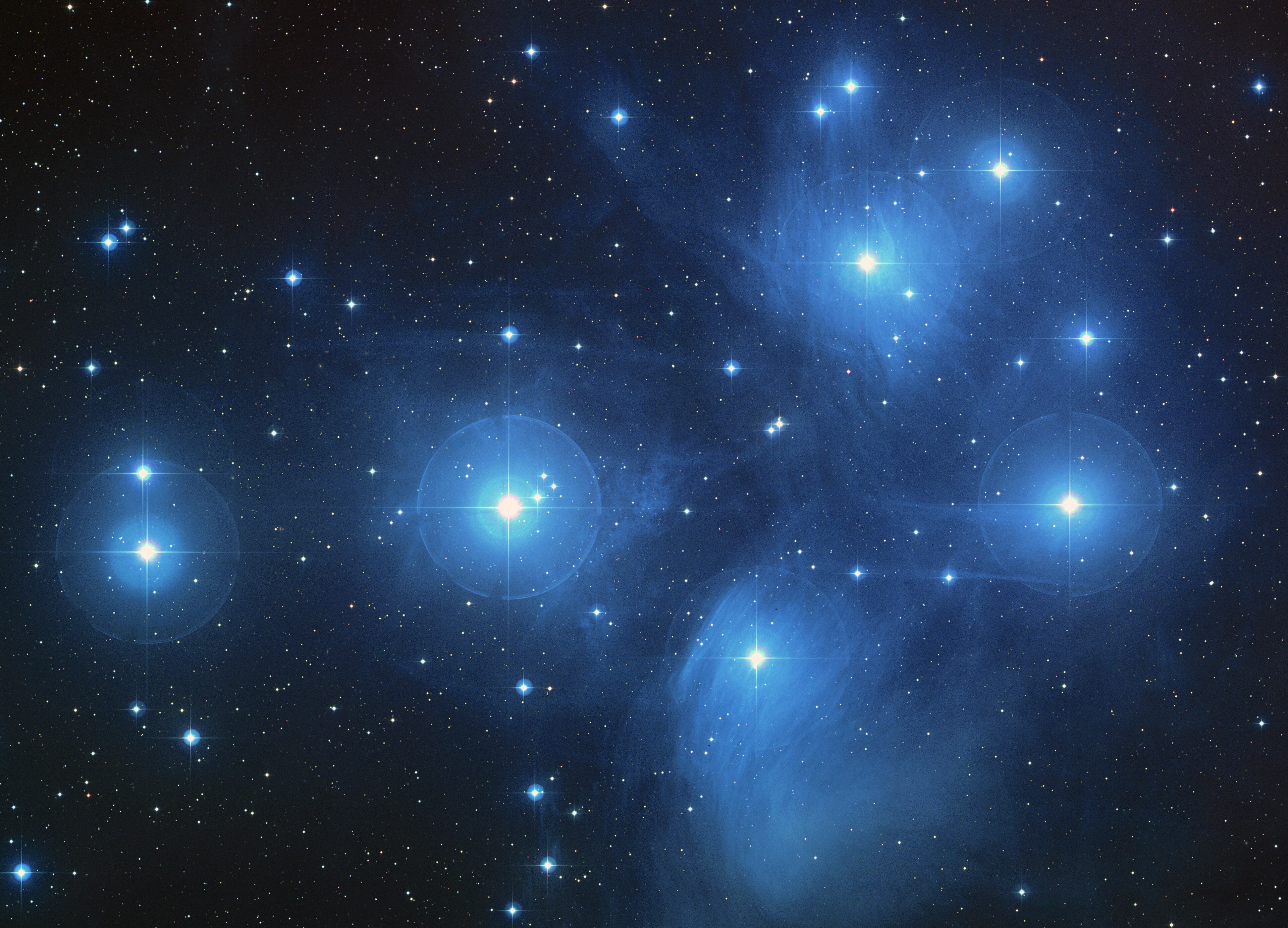 Pleiades star cluster with blue reflection nebulosity