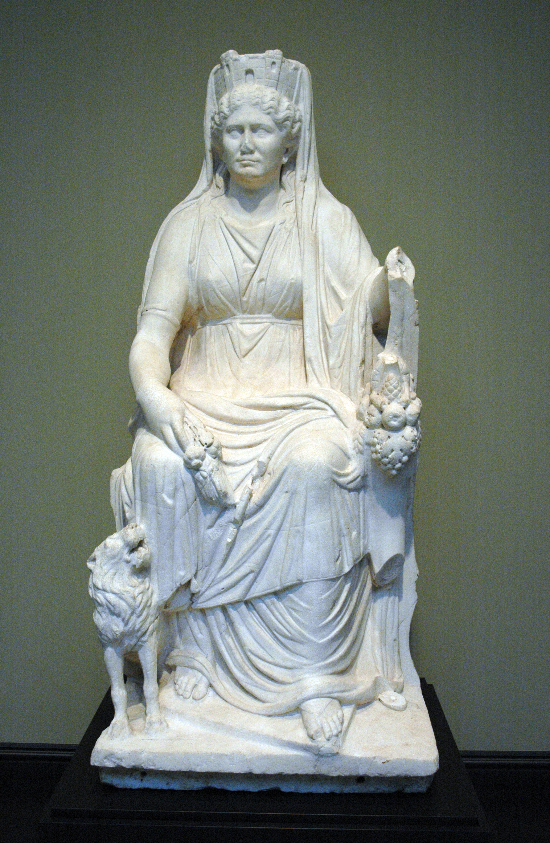 Seated marble statue of Cybele with lion, cornucopia and mural crown
