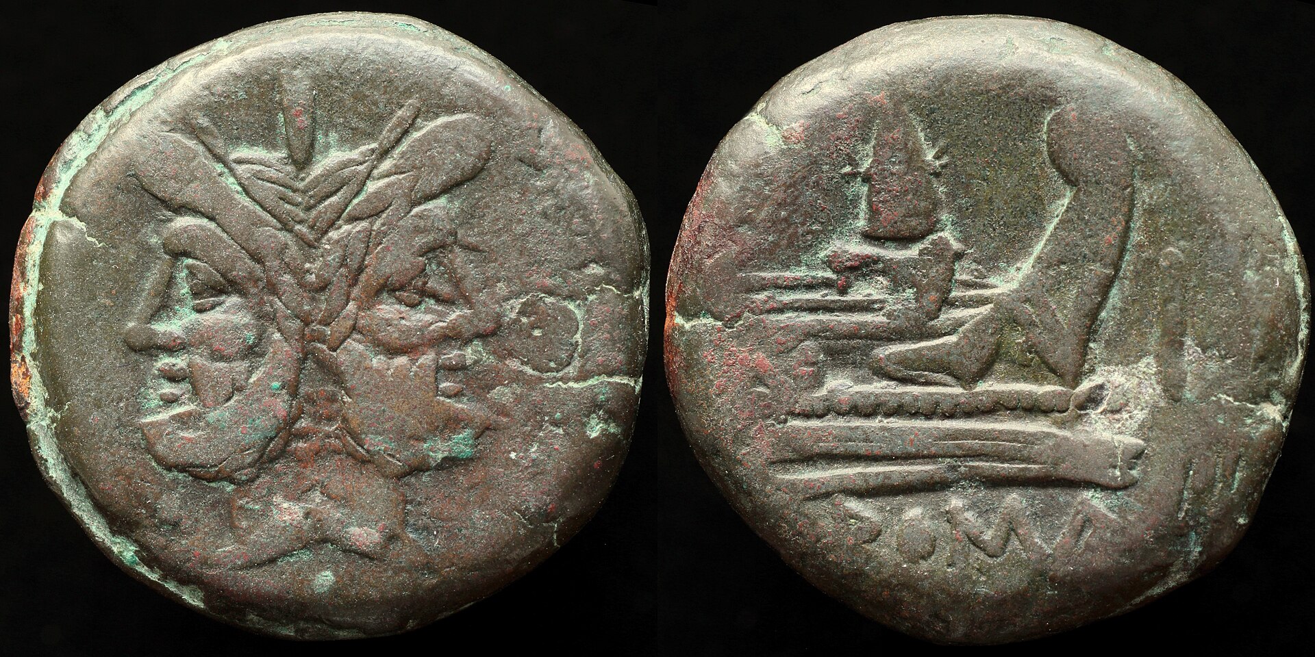 Two-faced head of Janus on a Roman Republican bronze coin, with ship’s prow reverse