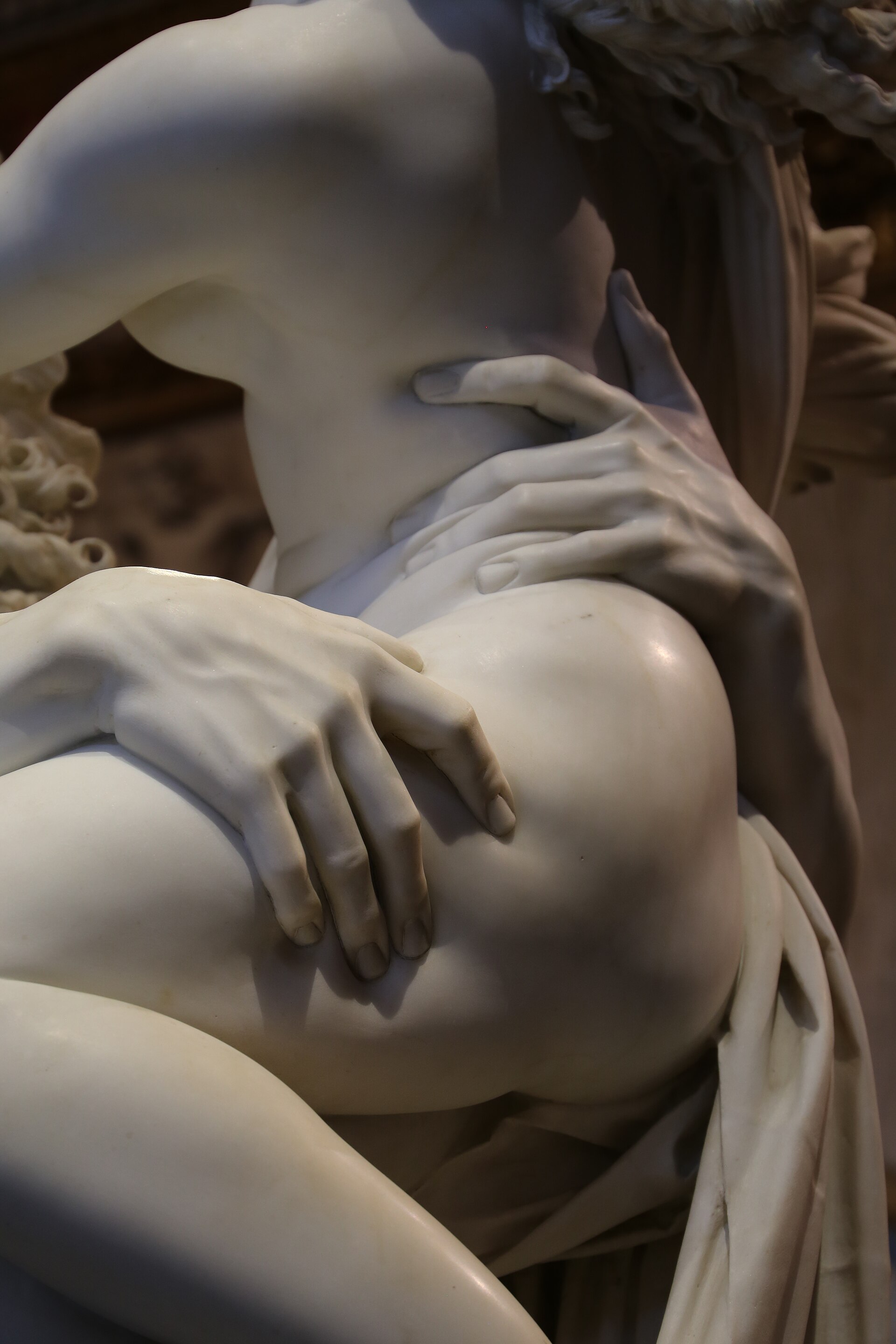 Detail of Bernini’s Rape of Proserpina: Pluto’s hand pressing into Proserpina’s marble thigh